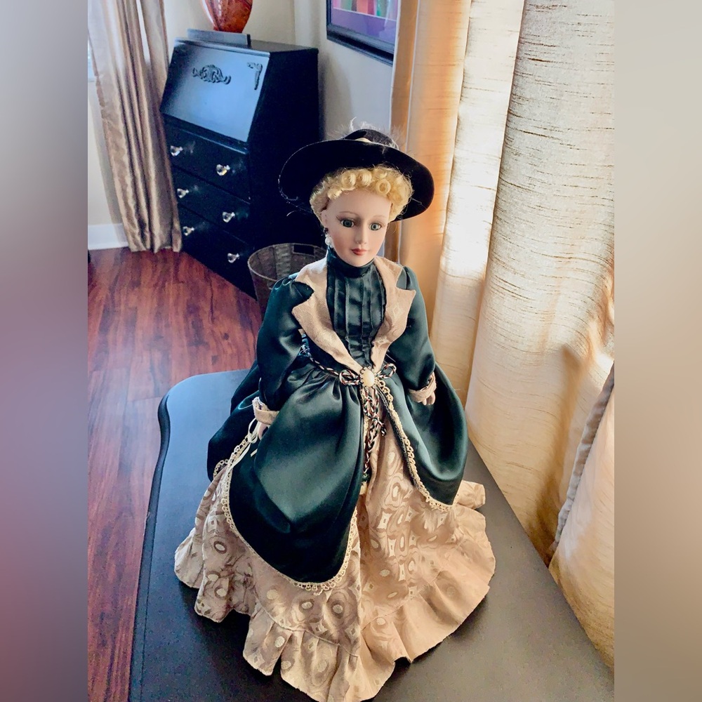 New in box. Elegant Victorian Porcelain Doll in Green and Cream Dress. Stand inc